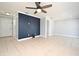 Large living room with tile flooring, ceiling fan, and neutral paint, ready for personalization at 607 Brittany Ct, Casselberry, FL 32707