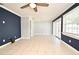 Spacious living area featuring tile floors, neutral walls, and a bright window at 607 Brittany Ct, Casselberry, FL 32707
