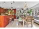 Open kitchen flows to dining area and features updated appliances and cabinetry at 6816 Greengrove Blvd, Clermont, FL 34714