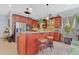 Kitchen with granite countertop island and stainless steel appliances at 6816 Greengrove Blvd, Clermont, FL 34714