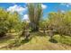 Beautifully landscaped garden pathway with ornate planters adding charm and elegance to the outdoor space at 6816 Greengrove Blvd, Clermont, FL 34714