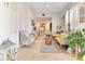 Bright living room with neutral decor, lots of natural light, and tiled floors at 6816 Greengrove Blvd, Clermont, FL 34714