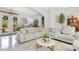 Comfortable living room with ample seating, stylish decor, and natural light, perfect for relaxation and entertaining at 6816 Greengrove Blvd, Clermont, FL 34714
