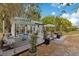 Charming outdoor living space featuring a spacious patio, stylish furniture, and lush greenery perfect for relaxation and entertaining at 6816 Greengrove Blvd, Clermont, FL 34714