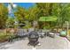 Cozy outdoor seating area with a fire pit, ideal for entertaining and enjoying the beautiful landscape at 6816 Greengrove Blvd, Clermont, FL 34714