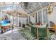 Inviting sunroom with stylish seating, tiled flooring, and abundant natural light, perfect for indoor relaxation at 6816 Greengrove Blvd, Clermont, FL 34714