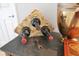 Close up of a stone countertop with a wine rack holding three bottles of wine in a decorative setting at 6816 Greengrove Blvd, Clermont, FL 34714