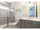 Nicely remodeled bathroom features a vanity, toilet, and large walk-in shower at 7928 Jacks Club Dr, Kissimmee, FL 34747