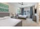 Shared bedroom features two twin beds, modern art, and a flat-screen TV at 7928 Jacks Club Dr, Kissimmee, FL 34747