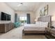 Bright and open main bedroom with access to the outdoors at 7928 Jacks Club Dr, Kissimmee, FL 34747