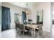 Bright dining room featuring a modern table, stylish light fixtures, and an open floor plan at 7928 Jacks Club Dr, Kissimmee, FL 34747