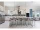 Open concept kitchen with stainless steel appliances, large island, and modern white cabinetry at 7928 Jacks Club Dr, Kissimmee, FL 34747