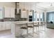 Open concept kitchen with stainless steel appliances, large island, and modern white cabinetry at 7928 Jacks Club Dr, Kissimmee, FL 34747