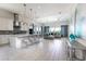 Open concept kitchen with stainless steel appliances, large island, and modern white cabinetry at 7928 Jacks Club Dr, Kissimmee, FL 34747