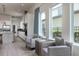 Sitting area with two chairs adjacent to the spacious, well-lit kitchen at 7928 Jacks Club Dr, Kissimmee, FL 34747