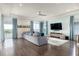 Comfortable living room with large sectional, modern decor, and bright windows at 7928 Jacks Club Dr, Kissimmee, FL 34747