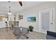 Living room and dining room area featuring wood floors and an open concept at 8107 Coconut Palm Way # 102, Kissimmee, FL 34747