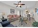 Living room and dining room area with wood floors and neutral color palette at 8107 Coconut Palm Way # 102, Kissimmee, FL 34747