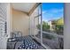 Screened patio featuring outdoor seating and views of landscaping at 8107 Coconut Palm Way # 102, Kissimmee, FL 34747