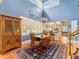 Sunny dining room with blue walls, cathedral ceiling, and hardwood floors at 811 Laurel Ave, Orlando, FL 32803