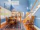 Bright dining room with staircase, hardwood floors, and kitchen view at 811 Laurel Ave, Orlando, FL 32803