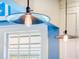 Kitchen island is lit by Edison pendant lights over dark countertop at 811 Laurel Ave, Orlando, FL 32803