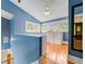 Bright landing area with hardwood floors, built-in storage, and natural light at 811 Laurel Ave, Orlando, FL 32803