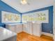 Bright landing area with hardwood floors, built-in storage, and natural light at 811 Laurel Ave, Orlando, FL 32803