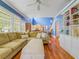 Spacious living room features hardwood floors, blue walls, and built-in shelving at 811 Laurel Ave, Orlando, FL 32803
