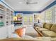 Living room boasts hardwood floors, built-in shelves, and view to the porch at 811 Laurel Ave, Orlando, FL 32803