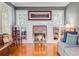 Living room showing a fireplace, built-in bookshelves, and natural lighting at 811 Laurel Ave, Orlando, FL 32803