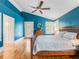 Stylish main bedroom features a vaulted ceiling, hardwood floors, and natural light at 811 Laurel Ave, Orlando, FL 32803