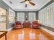 Sitting room with hardwood floors, ample natural light, and comfortable leather chairs at 811 Laurel Ave, Orlando, FL 32803