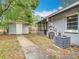 Backyard with shed, screened in porch, and modern AC unit at 844 Rosalia Dr, Sanford, FL 32771