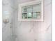 Updated marble tile shower with a window for natural light and a modern showerhead at 844 Rosalia Dr, Sanford, FL 32771