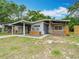 Charming single-story home featuring a covered carport and cozy front porch at 844 Rosalia Dr, Sanford, FL 32771