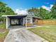 Inviting home with covered parking and a charming front porch, ideal for relaxation at 844 Rosalia Dr, Sanford, FL 32771