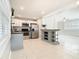 Well-lit kitchen with butcher block countertops, stainless steel appliances, and white and grey cabinets at 844 Rosalia Dr, Sanford, FL 32771
