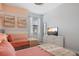 Inviting bedroom with two twin beds, modern decor, and a bright window at 8549 Zoeller Hills Dr, Davenport, FL 33896