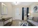 Inviting entryway with tile floors, console table, and modern decor at 8549 Zoeller Hills Dr, Davenport, FL 33896