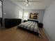 Bedroom with neutral walls, mirrored closet, ceiling fan, and a comfortable plaid comforter on the bed at 2524 Grassy Point Dr # 104, Lake Mary, FL 32746