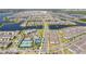 Wide aerial view of residential community with lakes, amenities, and well-organized street layout at 10209 Folly Beach Rd, Orlando, FL 32827