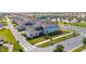 Neighborhood view showcasing well-planned streets, green spaces, and modern home designs at 10209 Folly Beach Rd, Orlando, FL 32827