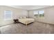 Primary bedroom with bright natural light, neutral carpet and bedside furniture at 10209 Folly Beach Rd, Orlando, FL 32827