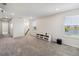 Bright bonus room with neutral carpet, recessed lighting and an entertainment center at 10209 Folly Beach Rd, Orlando, FL 32827