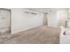 Bright bonus room with neutral carpet, recessed lighting and a nearby hallway at 10209 Folly Beach Rd, Orlando, FL 32827