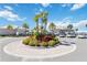 Circular drive with landscaped garden in front of the community center at 10209 Folly Beach Rd, Orlando, FL 32827