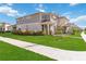 Charming two-story home featuring a quaint front porch and well-manicured lawn in a sidewalk neighborhood at 10209 Folly Beach Rd, Orlando, FL 32827