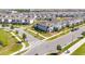 Desirable two-story home with green lawn and modern streetlights in a meticulously designed community at 10209 Folly Beach Rd, Orlando, FL 32827