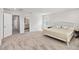Primary bedroom with bright natural light, neutral carpet and ensuite bathroom at 10209 Folly Beach Rd, Orlando, FL 32827